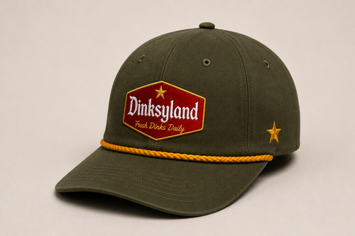 Dinksyland THE NEW G rope cap — loden green crown, amber gold rope, 01 Classic patch, 3/4 studio angle